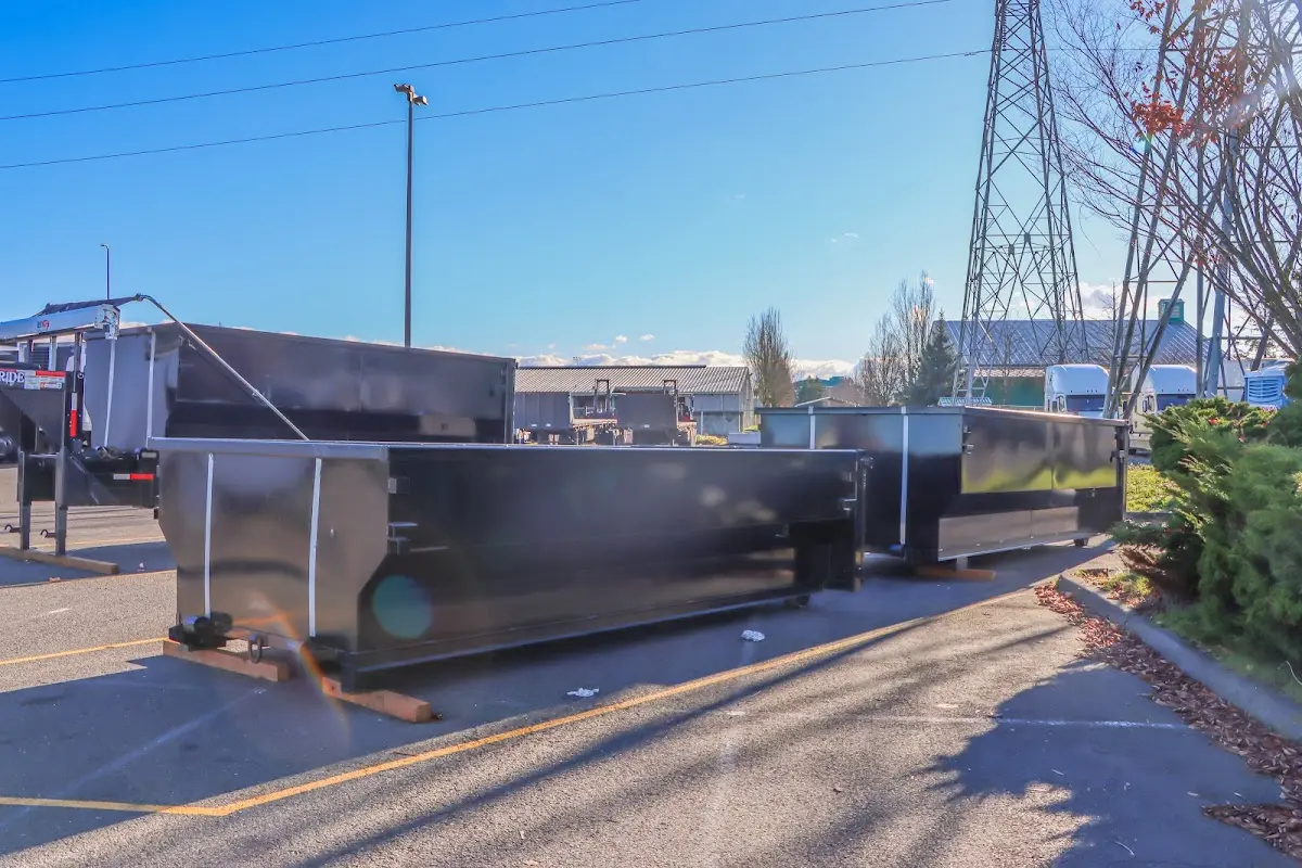 Roll-off dumpster ready for waste disposal at job site for Concrete Dumpster Rental in Lumberton
